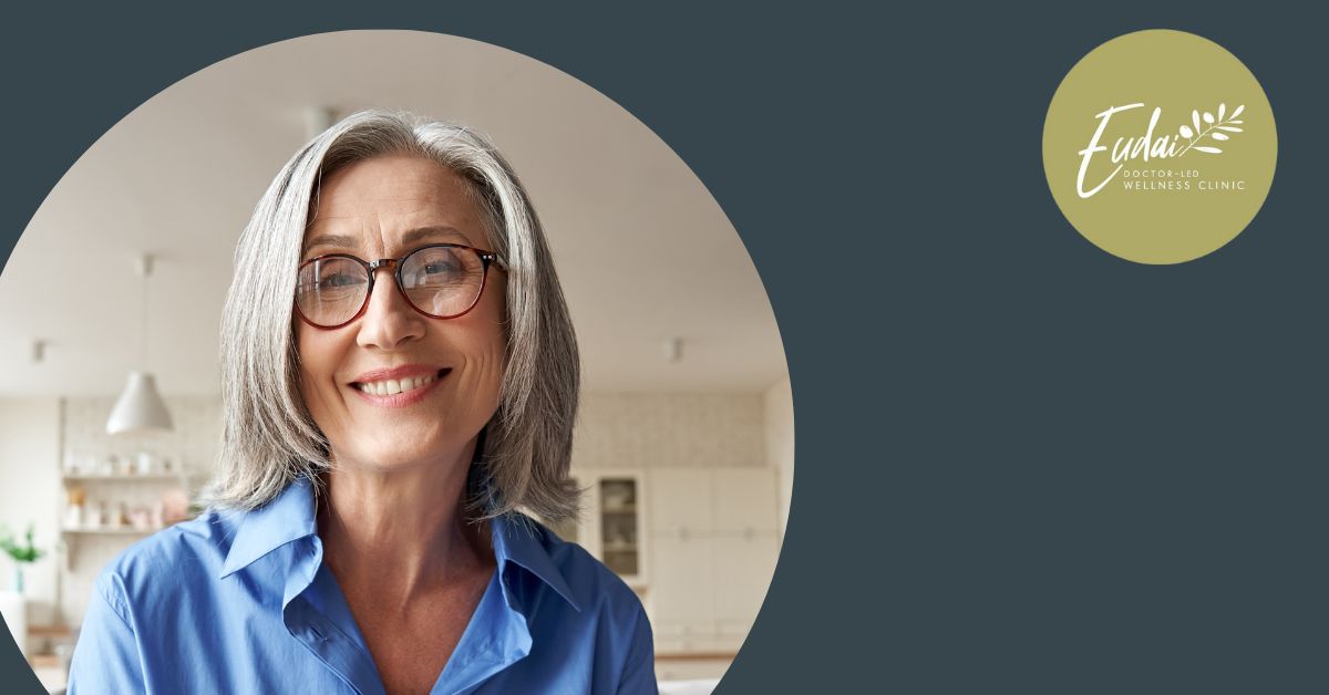 Eudai Clinic logo alongside a portrait of an older woman with gray hair and glasses, smiling confidently in a home setting.